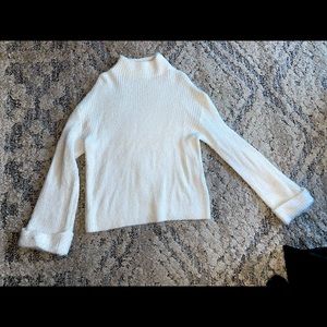 White bell sleeve fuzzy turtleneck sweater